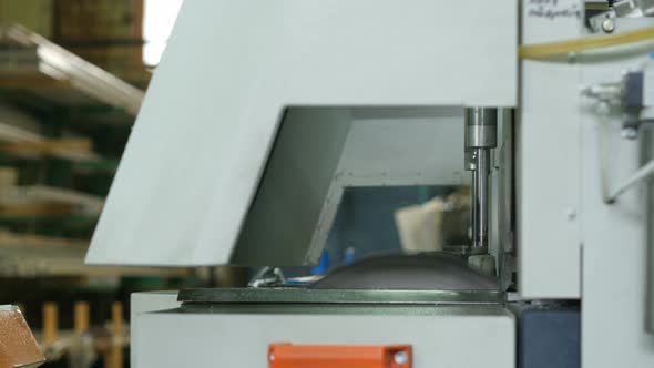 Line Production of Plastic Windows. Cutting PVC Profile with Circular Saw