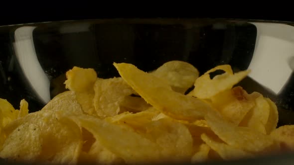 Potato Chips Spilling Into Bowl alt