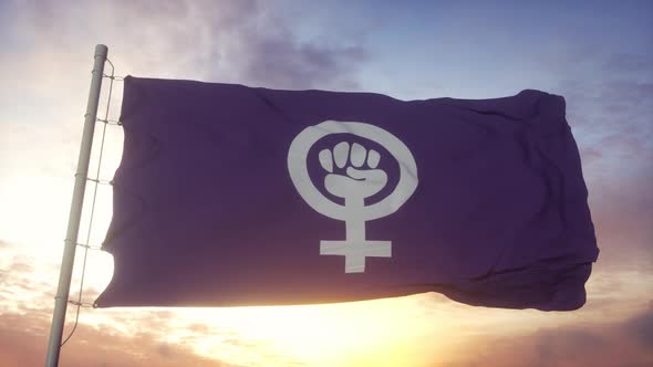 Feminist Pride Flag Waving in the Wind Sky and Sun Background alt
