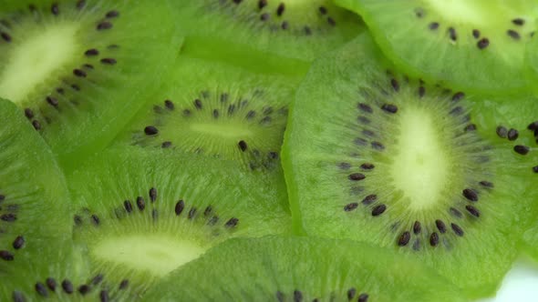 Background in the Form of Sliced Kiwi Spins Juicy Green Kiwi Fruit or Chinese Gooseberry alt