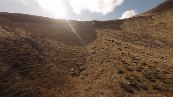 FPV Drone Footage Smooth Stabilized Fly Along Mountain Rocky Hill Around Highland Lake alt