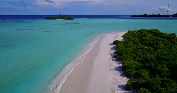 Luxury birds eye tourism shot of a white sand paradise beach and blue ocean background in colorful 4 alt