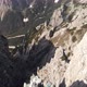 Aerial Unveil Man Hiker In Front of Cadini Mountain in Dolomites Italy - VideoHive Item for Sale