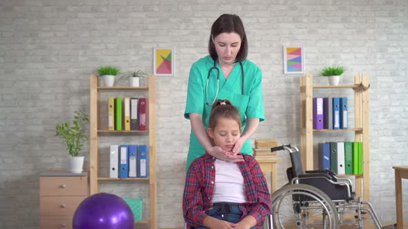 Physical Therapist in Rehab Is Doing the Treatment on the Neck of the Girl Adolescent alt