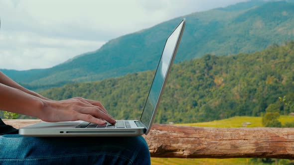 Using Laptop At Mountain alt