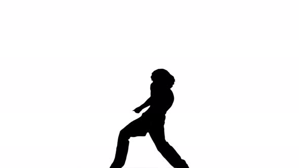 A Silhouette man Is Casually Dancing Against A White Background