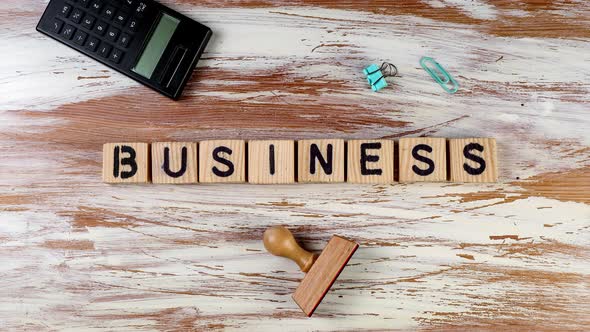 Business. Wooden alphabet blocks create text on the table