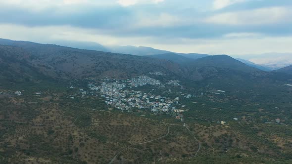 Flying Over a Small Greek Village. View From Above on the Landscapes of Greece, Crete. The Concept