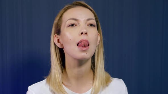 Anti-wrinkle Facial Exercises, Woman Is Showing, Stretching Tongue Up for Tensing Muscles alt