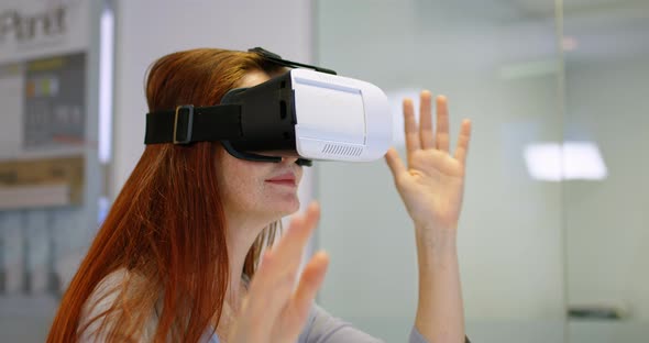 Businesswoman using virtual reality headset in a modern office 4k