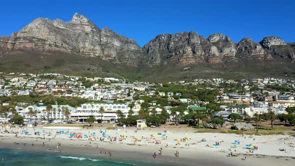 A nice and lovely summers day with beachgoers enjoying themselves in Camps Bay