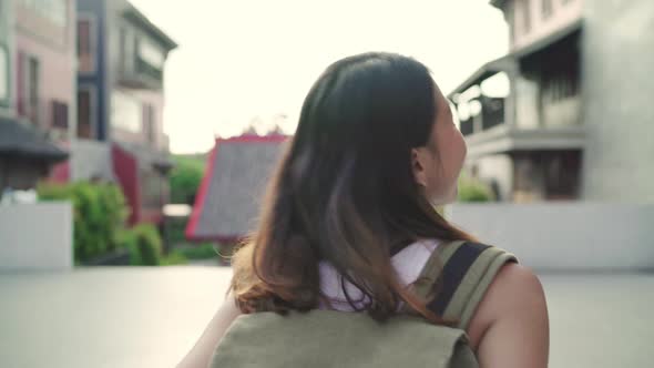 Asian backpacker woman feeling happy traveling blogger female walking at Chinatown. 