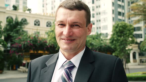 Concept Business Man Close Up of Cheerful Male Boss Looking at the Camera and Smiling alt