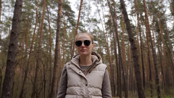 Beautiful Woman in Jacket Waistcoat Walk Alone Trailpath in Pine Forest in  alt
