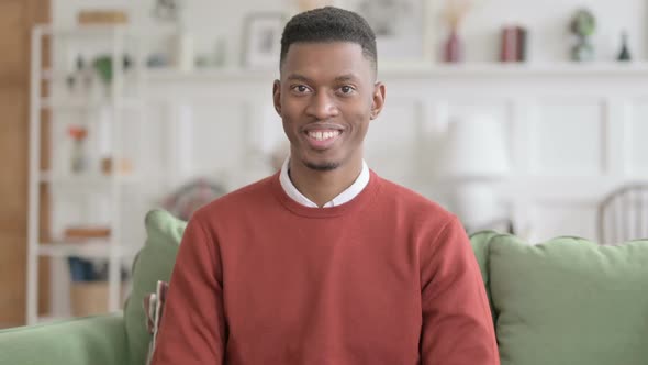 Portrait of Attractive African Man Smiling at Camera alt