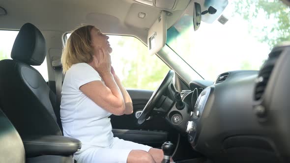 Happy Senior Woman Driving Sitting in New Car Wearing Seat Belts Preparing for First Trip Enjoying