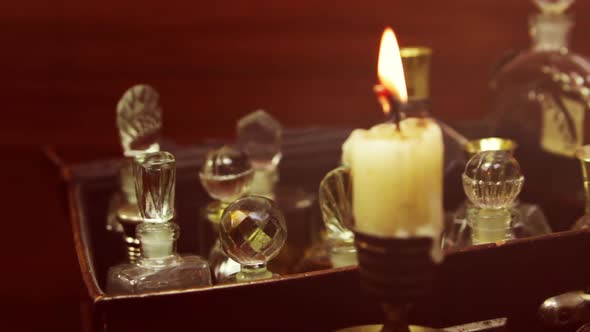 Candle And Perfume In Vintage Bottles Closeup