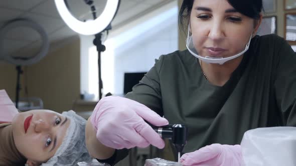 A Permanent Makeup Artist Prepares a Workplace Materials Tools for Lip Micropigmentation