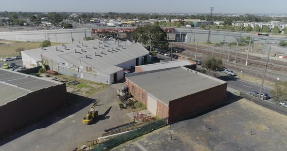 Yellow crane reversing in site yard ready to position itself correctly for the next load to be trans alt