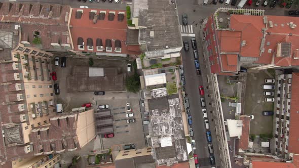 Narrow streets and private apartment building yards in Turin, aerial top down view alt