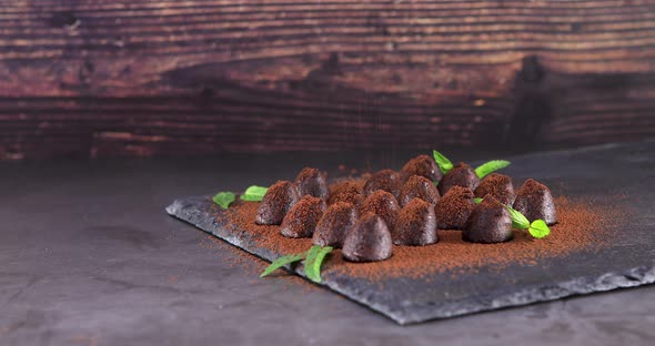 Powdering with Cocoa Chocolate Truffles on Slate 