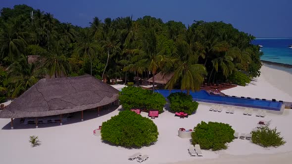 Sunny landscape of shore beach by water with sand background near surf alt