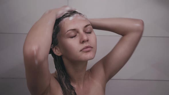 Woman Washes Head Under Shower alt