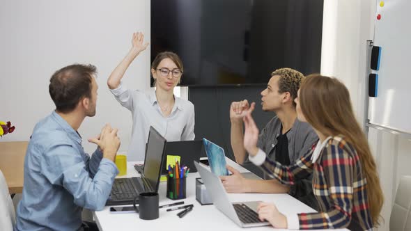 Team at Office Celebrationg Successful Work alt