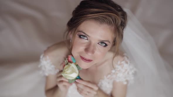 Beautiful, Lovely Bride in Night Gown and Veil. Wedding Morning. Wedding Bouquet alt