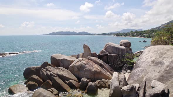 Beautiful 4K drone footage of the beach and unique rock features at Hin Ta Hin Yai Beach on Koh Samu alt