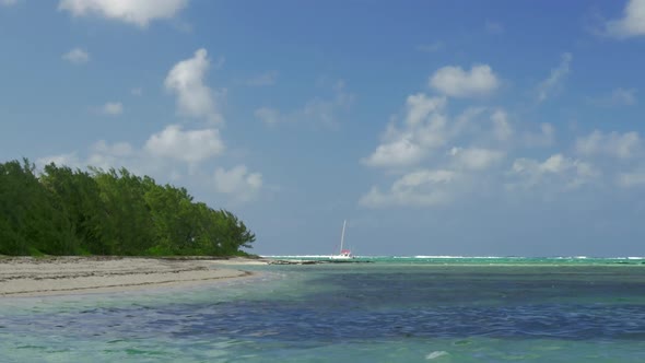 Picturesque View of Strand and Indian Ocean and Sailing Yacht, Mauritius Island alt