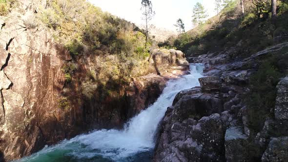 Crystal clear waters of Portela do Homem waterfall, Geres National Park, Portugal alt