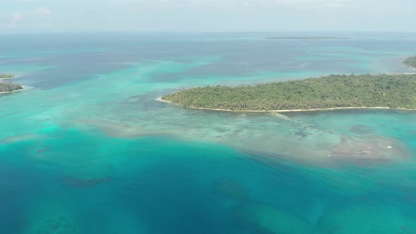 Aerial: flying over desert beach white beach tropical caribbean sea alt
