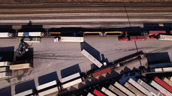 Reach stacker at work in logistic center of Vancouver terminal in Canada. Aerial top down view alt