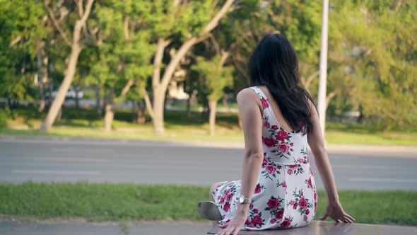 Round Motion Girl in Summer Dress with Red Flower Images alt