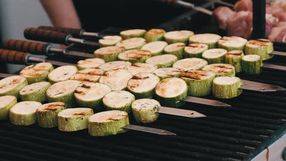 Zucchini Grilled on Skewers on the Open Barbecue at Food Court Vegan Shashlik alt