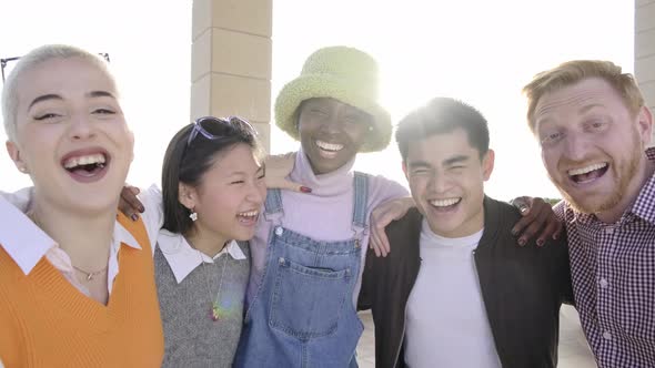 Multiracial group of people smiling at camera together