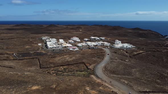 Aerial view of a small European coastal town with Atlantic Ocean backdrop alt