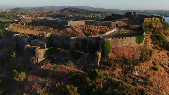cinematic aerial shot at sunset of Rozafa's Shkoder Castle. Albanian. alt