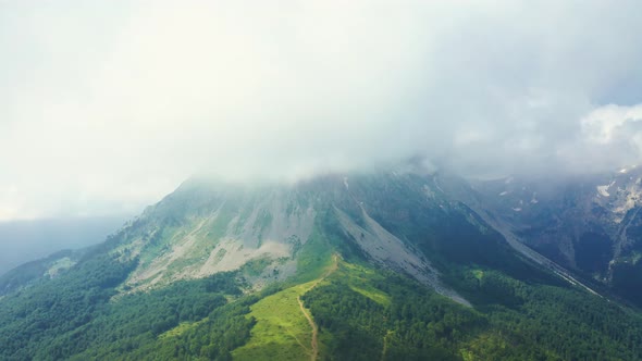 Flying Through the Clouds to the Top of the Mountain in Komovi Mountains Montenegro alt