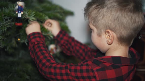 Boy Decorated Christmas Tree alt