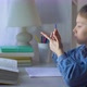 Little School Girl Counting on Fingers while Doing her Homework - VideoHive Item for Sale