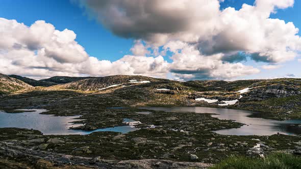 beautiful timelapse of cloudsing in over rocky mountains in south of norway alt
