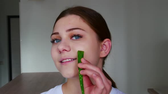 Beautiful Model Woman with Aloe Vera Leaf Portrait