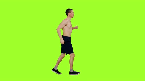 Young Man With Naked Torso Jogging