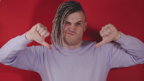 Young Handsome Man Speaks Into Mobile Phone alt