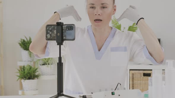 Female Cosmetologist is Giving Online Consultation alt