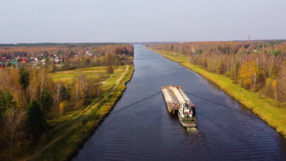 Aerial view:Barge on the River. Autumn Landscape, River Canal Near the Forest alt