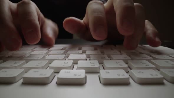 Close-up time lapse typing on keyboard with fingers. Macro soft focus dolly shot alt