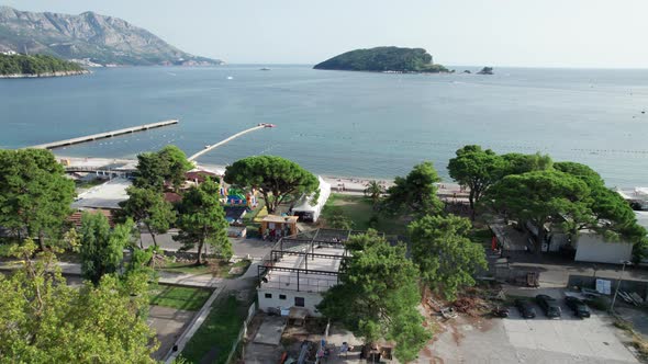 Aerial View Budva Beach By Sea with Sun Loungers and People Seashore Montenegro alt